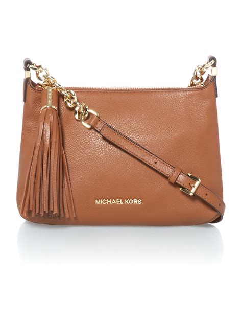 which crossbody handbag is better michael kors or coach|hand held crossbody bags.